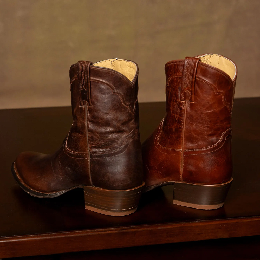 Featuring the Sheridan 8" Western boots in dark brown and brown.