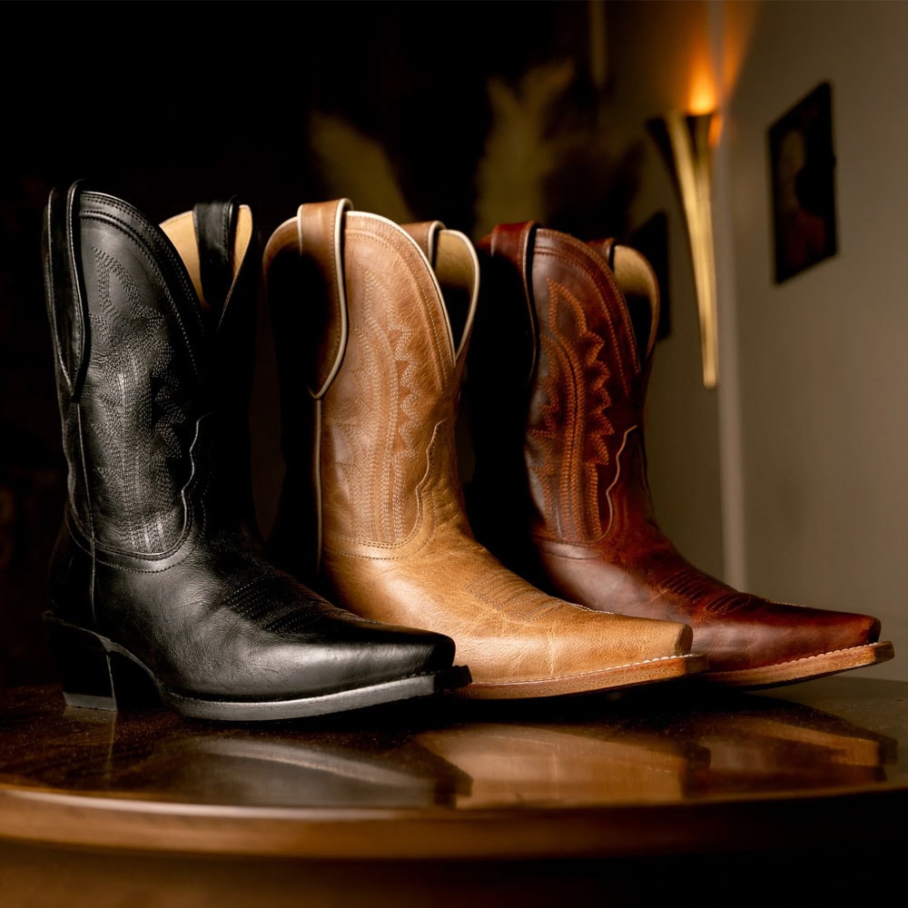 Areli 9" Bootie in black, tan and brown.