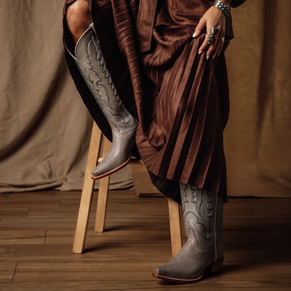 Featuring the Ainsley 17" Lizard western boot in Silver.