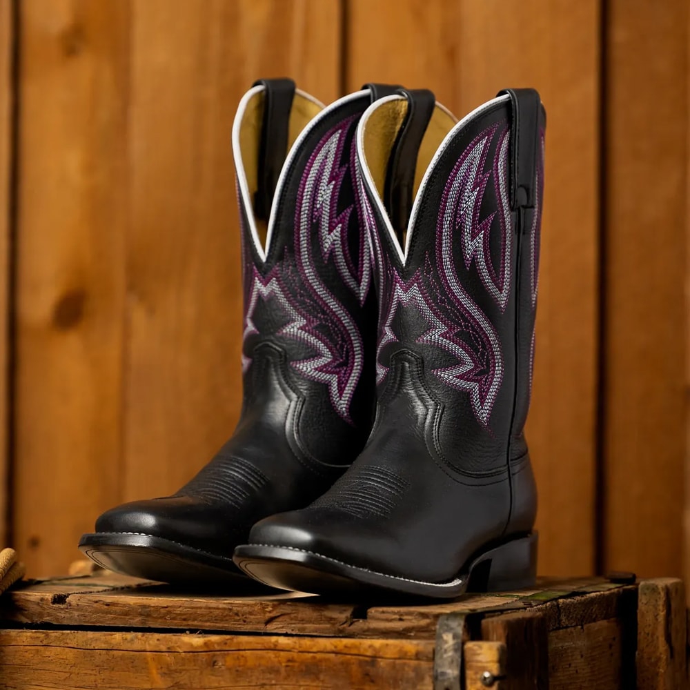 Featuring the Darcia 11" Western boot in Black.