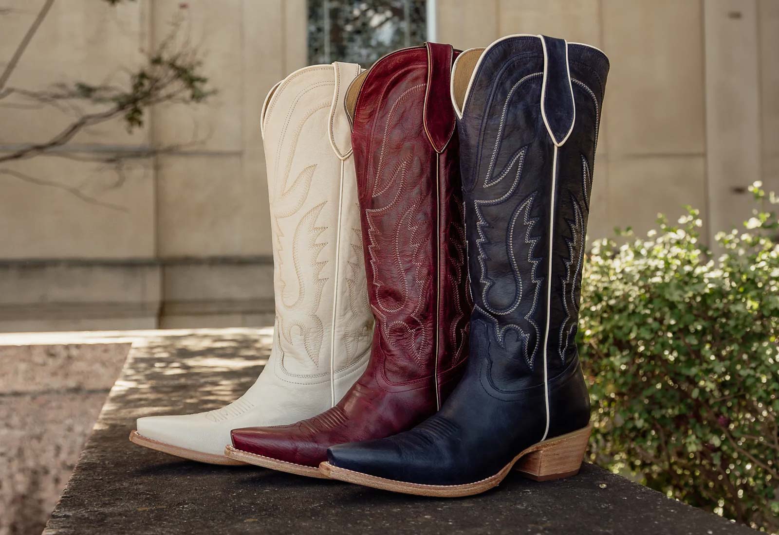 Featuring the Jess 15" Western boot in white, red annd blue.