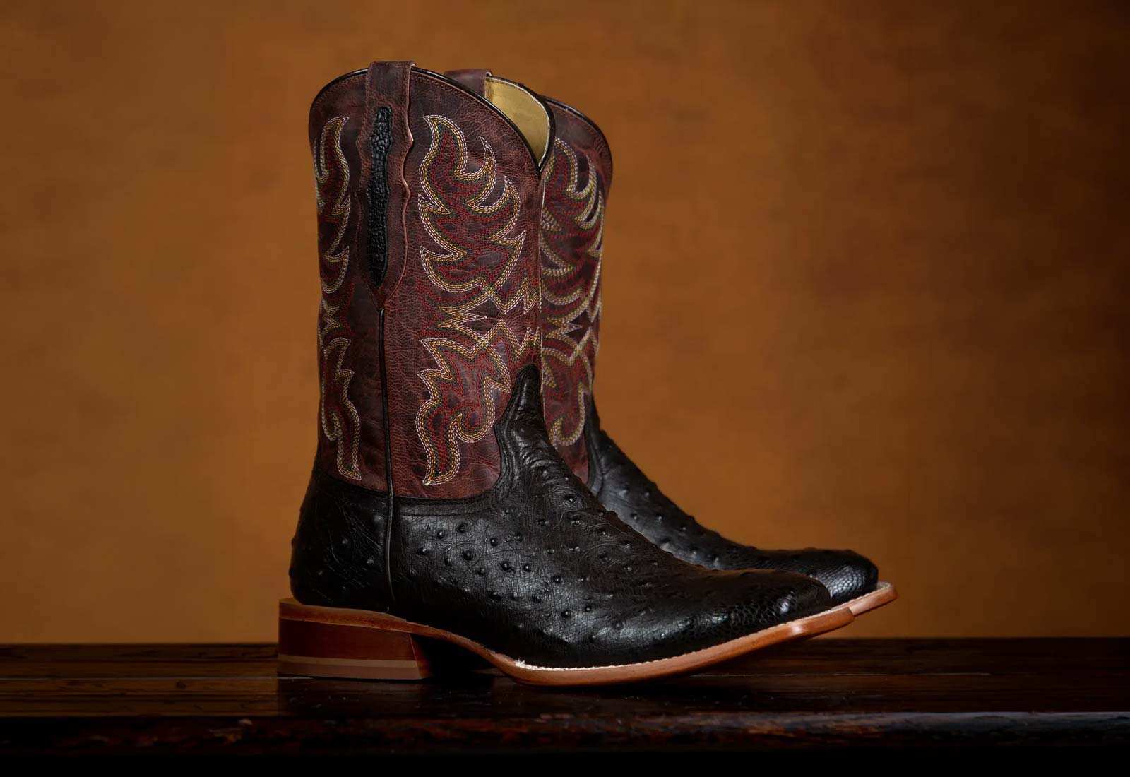 Featuring the Blaine 11" Ostrich Western boot in brown and black.