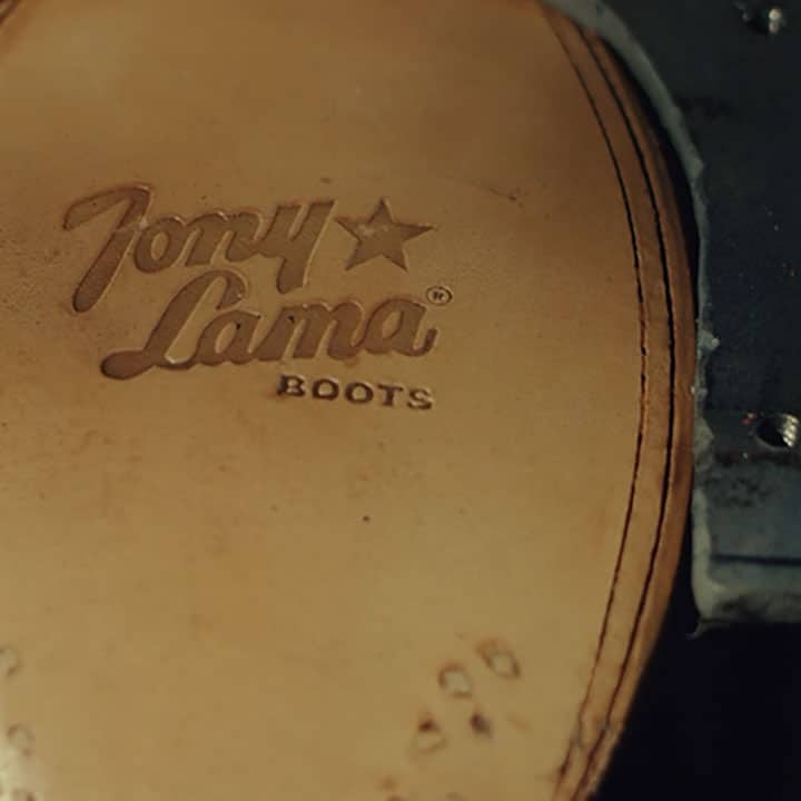 Sole of a boot with a Tony Lama Boots logo stamped into the leather.